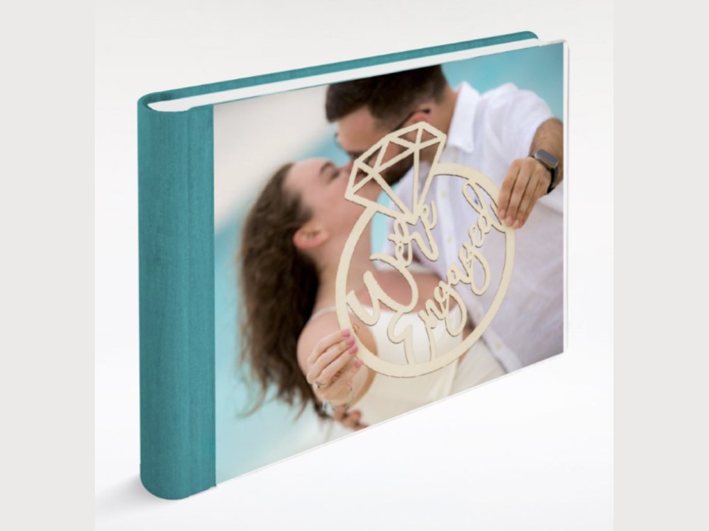 Custom photobook with a teal linen cover