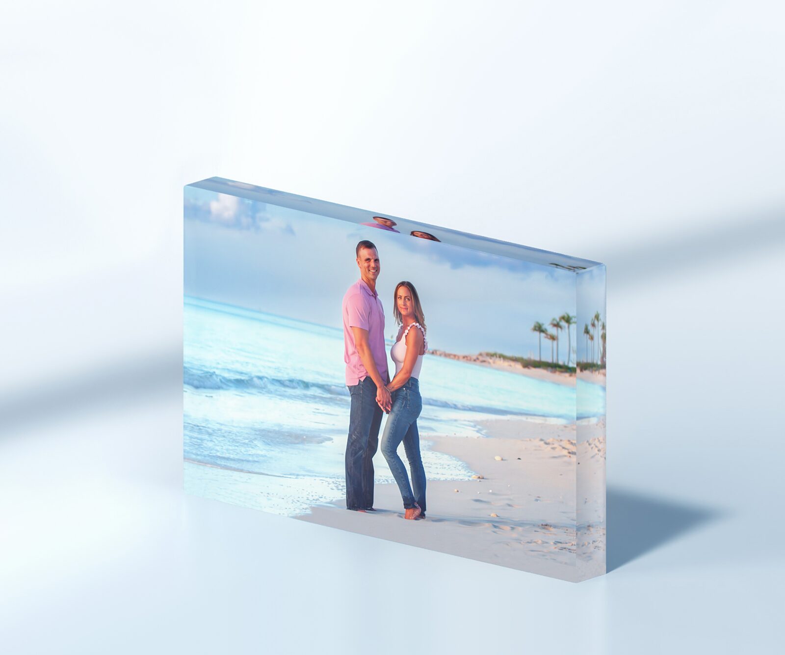 A crystal glass block print of a couple on the beach