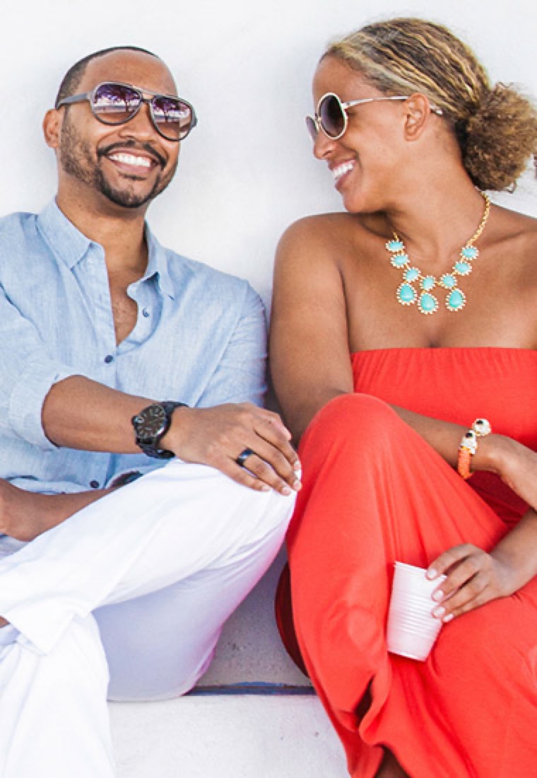 Couple laughing together on a boat deck